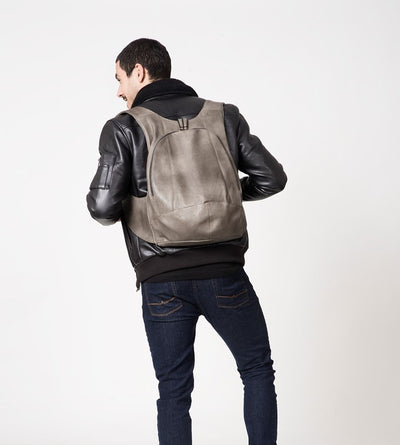 champagne metallic color Arsayo backpack with a man model