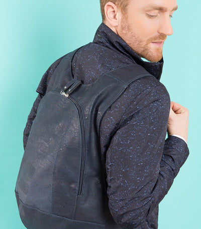 photo of the blue navy Arsayo  backpack with a man model