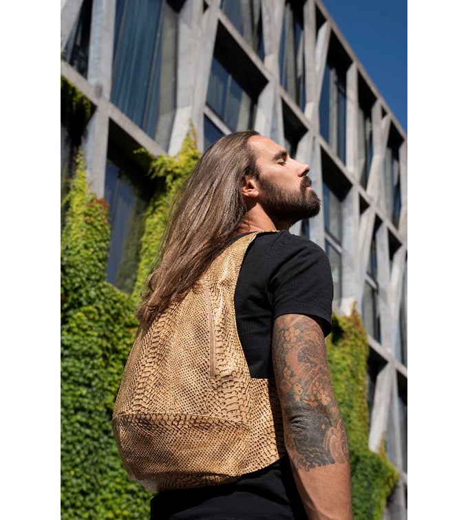 snake skin cork Arsayo backpack with a man model
