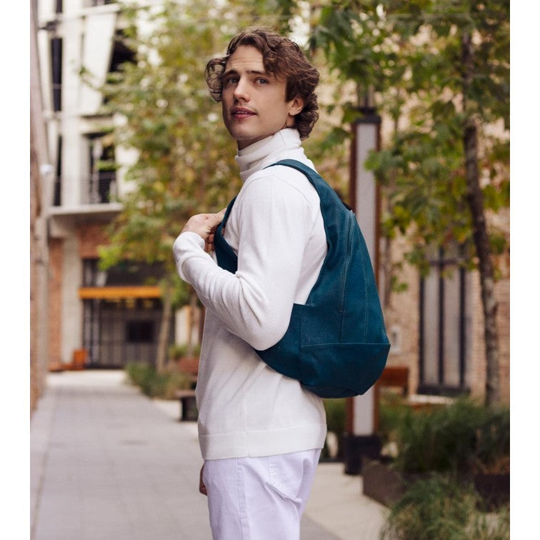 peacock blue Arsayo backpack with a man model