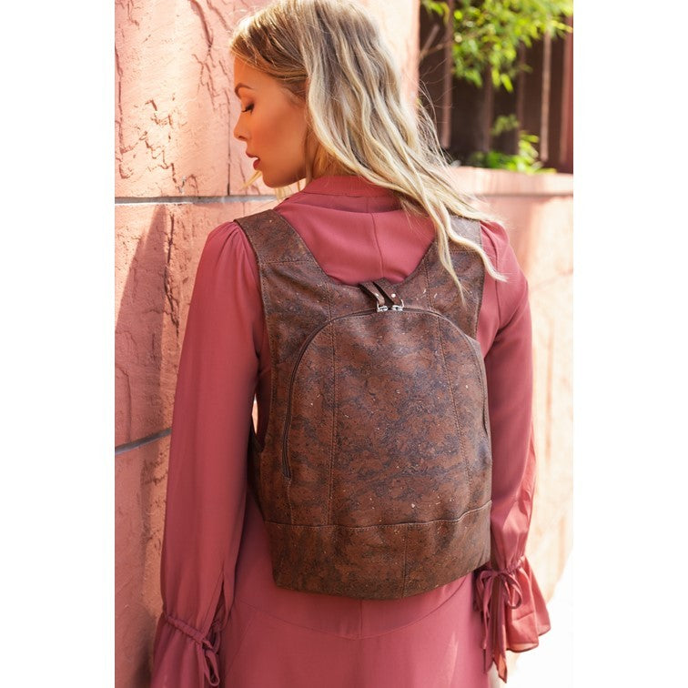 photo of the dark natural cork Arsayo backpack with a woman model