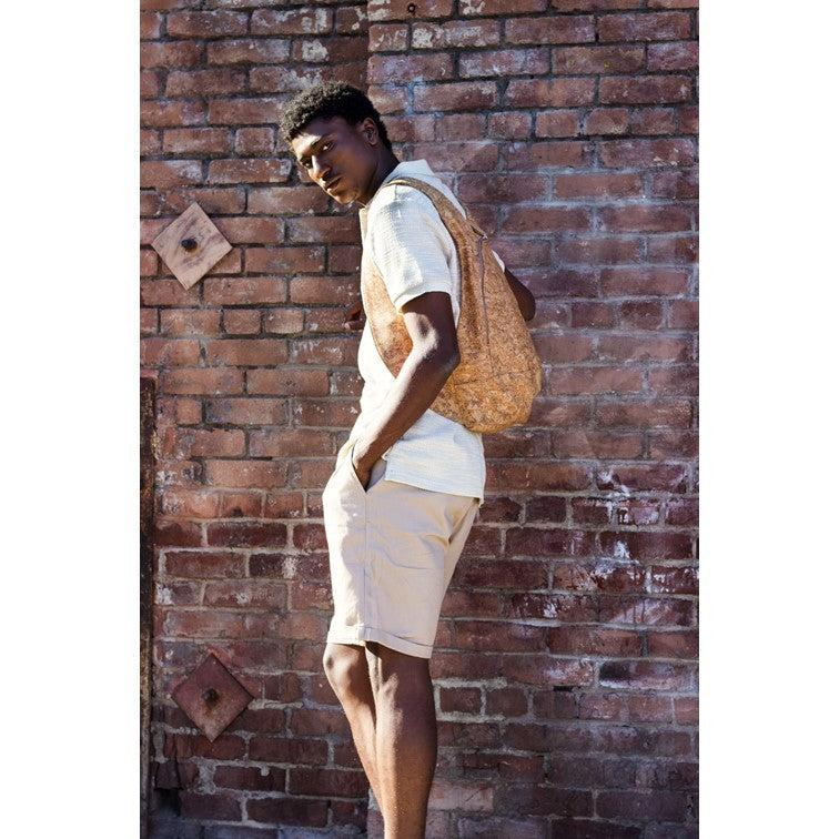 photo of the light natural cork Arsayo backpack with a man model